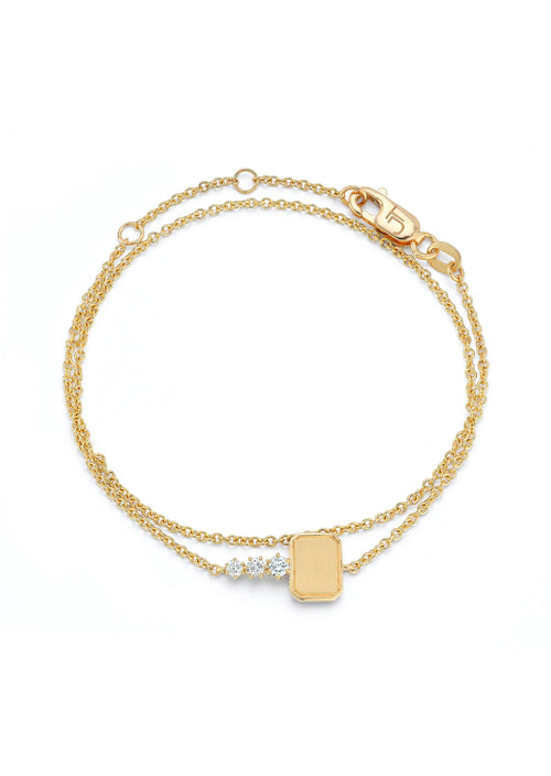 A new iteration of our signature Mini Catherine Key, the Mini Catherine Key Wrap Bracelet takes our bestselling silhouette and transform it into any entirely new category. Handcrafted in 18-karat gold and featuring 0.15tcw of round, brilliant-cut diamonds. Fastened with our cable link chain, this bracelet delicately wraps around your wrist twice for a cool and causal look. 