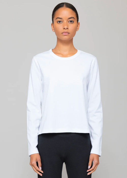 Leset Margo Long Sleeve in White. The Margo Long Sleeve is a classic crewneck long sleeve t-shirt that strikes the perfect balance between a tailored and relaxed silhouette. The classic crewneck design exudes sophistication and elegance, while the tailored yet relaxed silhouette ensures ultimate comfort. From day to night, this t-shirt strikes the perfect balance between style and relaxation.