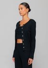 Leset Pointelle Classic Crew Cardigan in Black. A must-have classic cardigan in a timeless black soft cotton pointelle that is lightweight and great for traveling. Made from soft, lightweight cotton, this timeless piece is perfect for warm-weather layering. It's a must-have for any fashion-forward individual looking to add a touch of luxury to their collection.