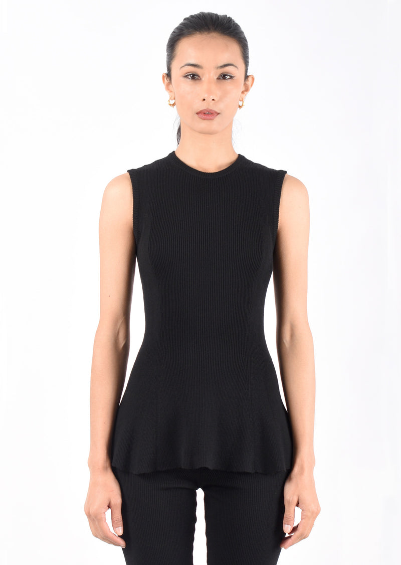 Lars Andersson's 2x1 Peplum tank is made from 100% Superfine Merino Wool with a beautiful ribbed texture - available in classic black. Easy to layer - perfect top for putting under your favorite blazer. This top offers the perfect balance of weight with a fitted top and peplum waist. Lars Andersson 2x1 Peplum Tank in Black Merino Wool