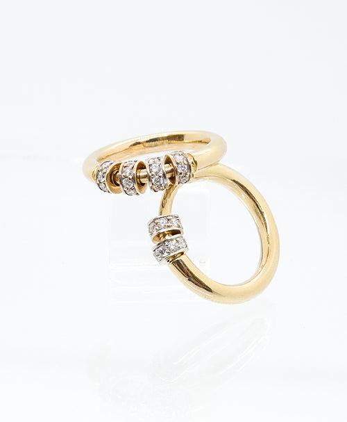 Introducing the Recreo Jewelry Diamond Spinner Ring, a mesmerizing blend of elegance and playfulness! Crafted from 14k yellow gold, this ring features two spinning beads, each inlaid with eight pave diamonds, adding a touch of sparkle to your every movement.  Twist it, spin it, play with it - the possibilities are endless! Perfect for stacking with other rings or wearing alone as a statement piece.&nbsp;  Elevate your style with this unique and versatile accessory from Recreo Jewelry.