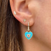 It's a love explosion on the Trust Your Heart Charm Pendant. This natural turquoise tablet is set in 14k yellow gold with a gold and diamond starburst exploding from it. A single red ruby sparkles in the center. Wear on Three Stories hoop earrings or add an openable pendant bale and wear on a Three stories chain necklace or bracelet. 