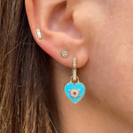 It's a love explosion on the Trust Your Heart Charm Pendant. This natural turquoise tablet is set in 14k yellow gold with a gold and diamond starburst exploding from it. A single red ruby sparkles in the center. Wear on Three Stories hoop earrings or add an openable pendant bale and wear on a Three stories chain necklace or bracelet. 