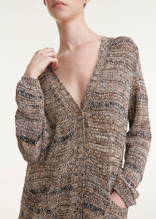 Cividini Handknit Think Metallic Cardigan. This oversized cardigan features tons of fabulous details. From the metallic thread woven through out to the the fabulous drape, hand woven texture, and front pockets - we just know this is going to be your new go-to!