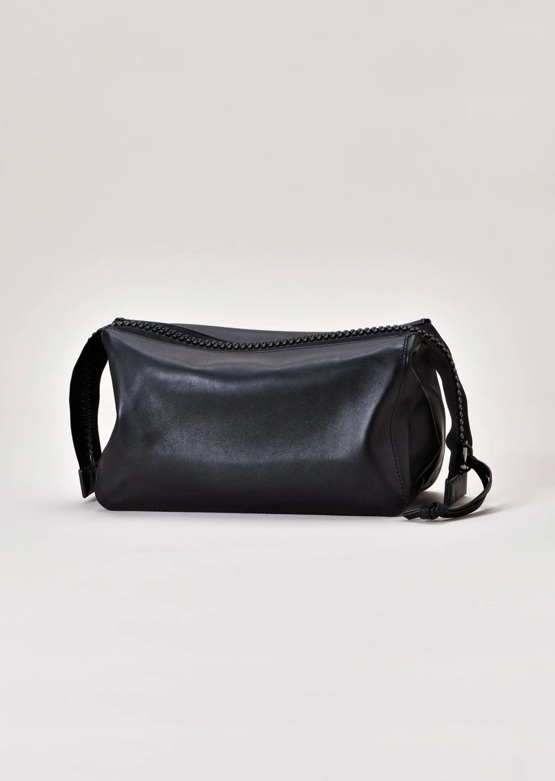 The perfect size to fit all your essentials when a bigger bag just won’t do. Easily fits a tablet or a small laptop. BAG ESSENTIAL can be worn alone as a clutch or add an adjustable strap to create a crossbody.  Dimensions: 10” wide (15” with gussets extended), 8” long, 5 ½” deep  Made in Italy Luxury Leather Fully Washable Lining Lightweight Construction Utilitarian Zipper 