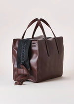 Harmin Your Handle Bag in Brown. Perfectly proportioned, YOUR HANDLE is a daily companion that exudes modern glamour. Features include interior flaps for added security and can be worn handheld, on the forearm, or add adjustable strap for hands-free ease.   The adjustable strap is included in the price.  Dimensions: 12 ⅞ wide (18 ⅞” with gussets extended), 8 ¼” long, 6 ¼” deep  Made in Italy Luxury Leather Fully Washable Lining Lightweight Construction Utilitarian Zipper