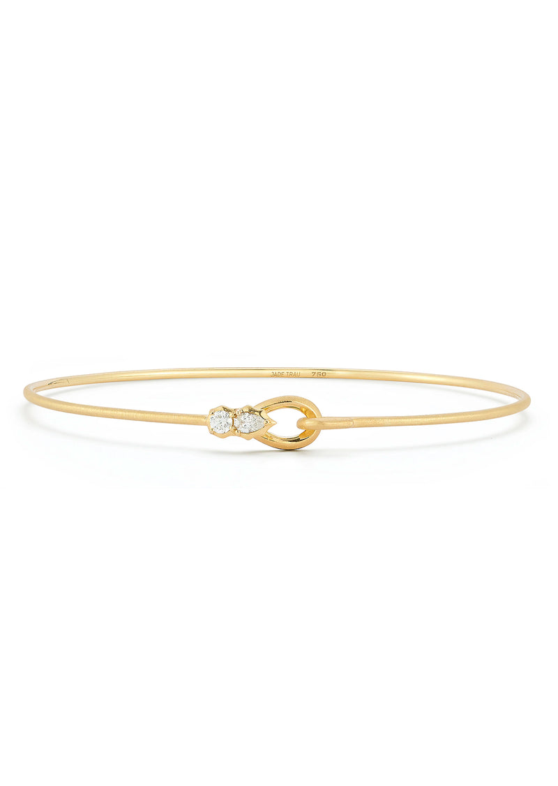 A great starter or building piece to your bracelet stack, the Posey Two Stone Bangle is an easy to wear wire bangle that packs a substantial punch. Handcrafted in 18-karat and featuring 0.13tcw of round and pear shaped diamonds, the Posey Two Stone Bangle is lightweight and goes with anything.   Handcrafted in 18K Gold Diamond: 0.13 tcw Fits Wrist Size: 16 - 17cm   Made in NYC