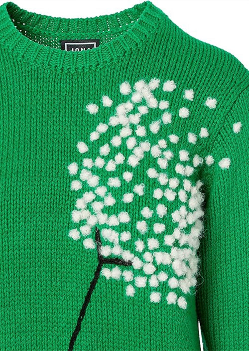 This pullover features a large embroidered image of a dandelion. Jonathan Coehn took the motif from the Queen Anne’s Lace floral print and made it larger, and it looked as if it were blowing in the wind. This reminded me of a dandelion, and so he re-worked it to create this beautiful embroidered design.