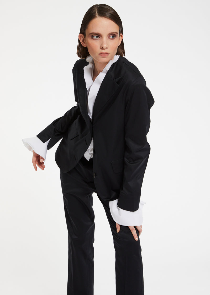 An elegant and timeless piece designed to elevate any outfit, the Maddie Blazer boasts a sophisticated three button lapel collar and two convenient flap pockets. Its classic silhouette, complete with a fitted shoulder and curved hem, exudes luxury and style. Perfect for any occasion, this blazer's 7/8 sleeve adds a touch of modern flair to its otherwise timeless design.