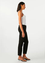 Amo Easy Trouser in Black. The Easy Army Trouser is a slightly relaxed, crop straight leg pant with trouser styling, a cropped ankle length, and a single button with zip fly enclosure. Just like its name, it's meant to feel easy to wear and effortless to style. Black cropped pants, super soft.