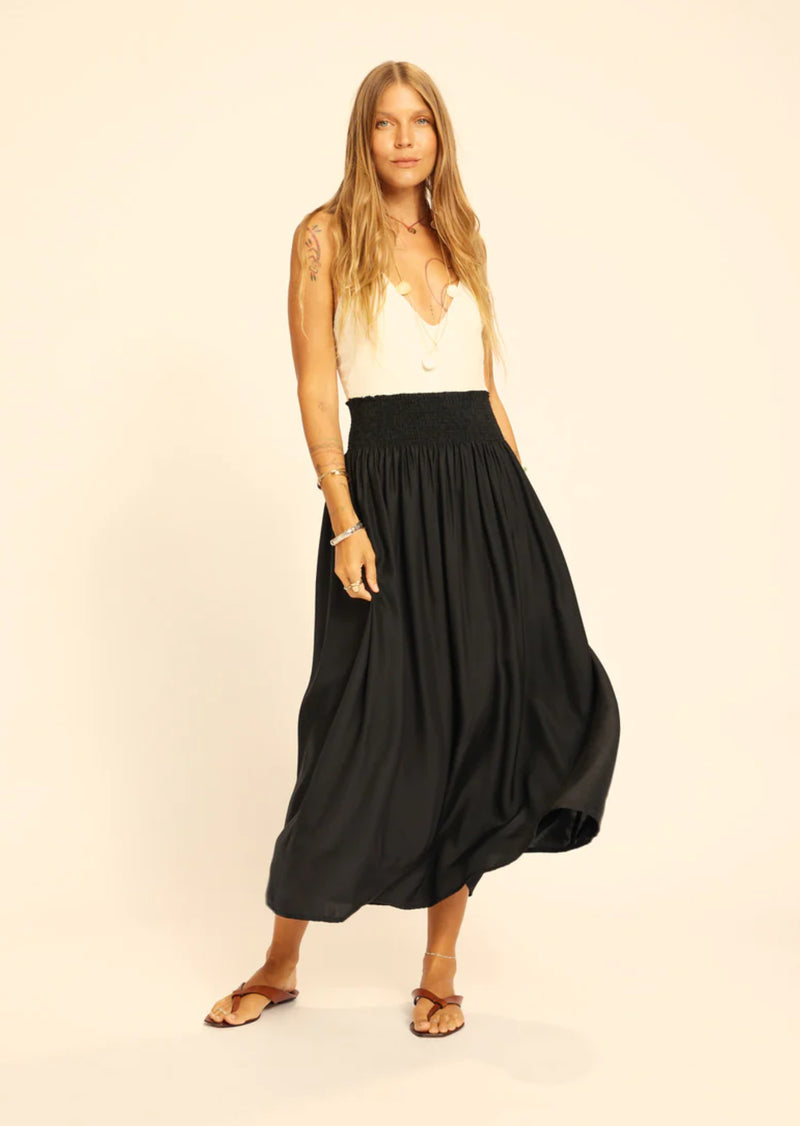 The Bella Skirt is a gorgeous maxi skirt with a smocked elastic waist featuring a raw hem. Elevate your wardrobe with this stunning maxi skirt. Its smocked elastic waist ensures a comfortable fit, while the raw hem adds a touch of edge. The perfect choice for those seeking comfort and style.