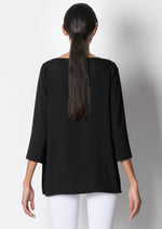 The three quarter sleeves and round neck create a classic look, while the side slits and comfort fit ensure a flattering fit for all body types. Whether you're dressing up for a night out or dressing down for a casual day, this blouse will become a wardrobe staple that you can rely on for both comfort and style.