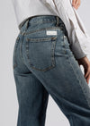 Indulge in the luxurious comfort of these Nine in the Morning Deepa Palazzo Jeans, featuring a soft straight leg design, a mid-rise waist, and a sleek zip and silver plated button fastening. Adorned with a sophisticated logo label on the back, these five-pocket denim jeans exude an air of refinement and comfort.