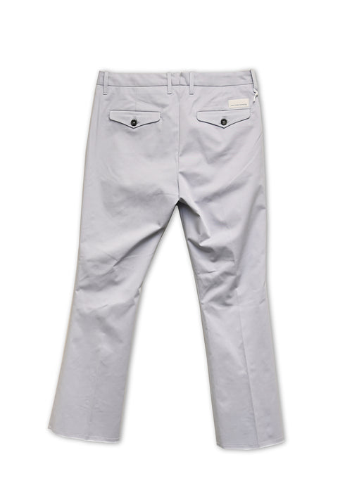 Elevate your wardrobe with Nine in the Morning's Rome Trumpet Pants. Crafted from a crisp stretch cotton, these dress pants feature horn buttons, a zip closure, and 4 pockets. The elegant pearl grey color and fringe edge add a touch of sophistication.  Perfect for dressing up or down, these mid-rise pants are a luxurious addition to any ensemble!  Material:  98% Cotton & 2% Elastane