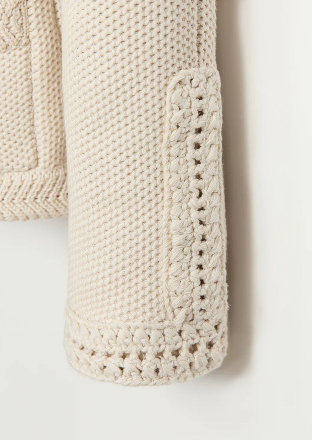 Constructed from luxurious Turkish cotton, The Merion sweater boasts a statement-making combination of seed stitch and hand-crocheted trims, inspired by vintage designs. Perfectly pairs with your favorite bottoms.