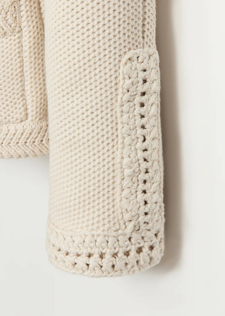 Constructed from luxurious Turkish cotton, The Merion sweater boasts a statement-making combination of seed stitch and hand-crocheted trims, inspired by vintage designs. Perfectly pairs with your favorite bottoms.