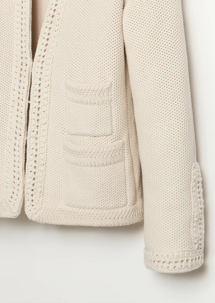 Constructed from luxurious Turkish cotton, The Merion sweater boasts a statement-making combination of seed stitch and hand-crocheted trims, inspired by vintage designs. Perfectly pairs with your favorite bottoms.