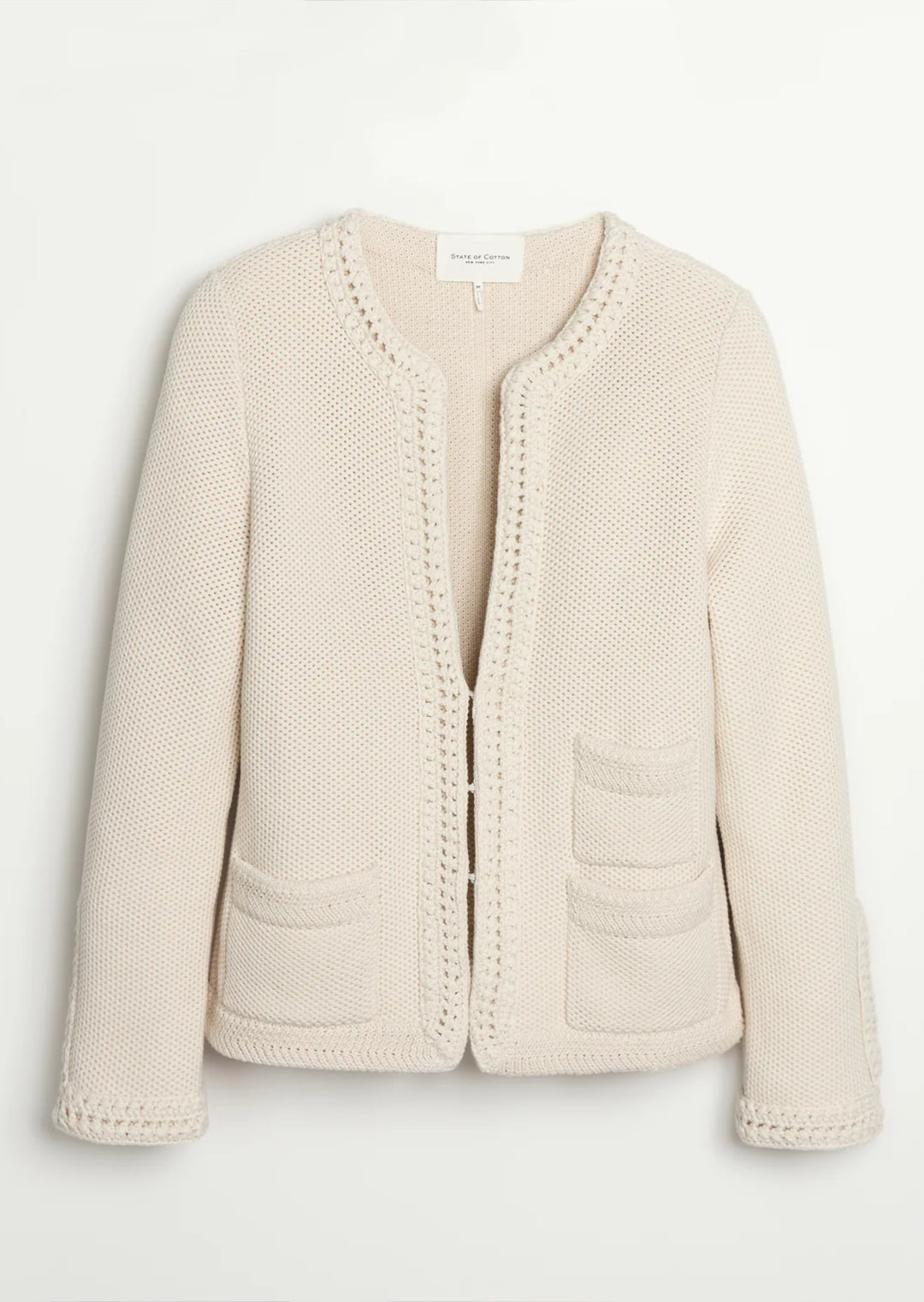 Constructed from luxurious Turkish cotton, The Merion sweater boasts a statement-making combination of seed stitch and hand-crocheted trims, inspired by vintage designs. Perfectly pairs with your favorite bottoms.