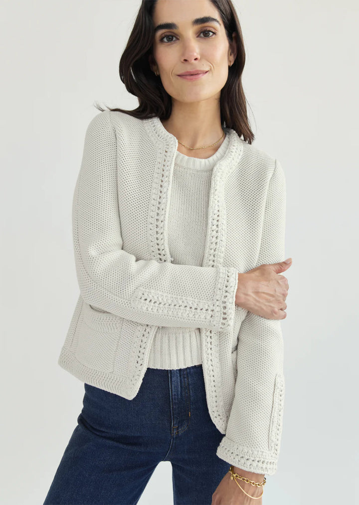 Constructed from luxurious Turkish cotton, The Merion sweater boasts a statement-making combination of seed stitch and hand-crocheted trims, inspired by vintage designs. Perfectly pairs with your favorite bottoms.