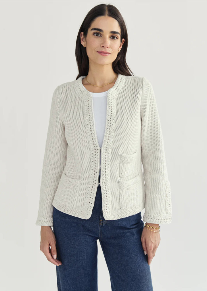Constructed from luxurious Turkish cotton, The Merion sweater boasts a statement-making combination of seed stitch and hand-crocheted trims, inspired by vintage designs. Perfectly pairs with your favorite bottoms.