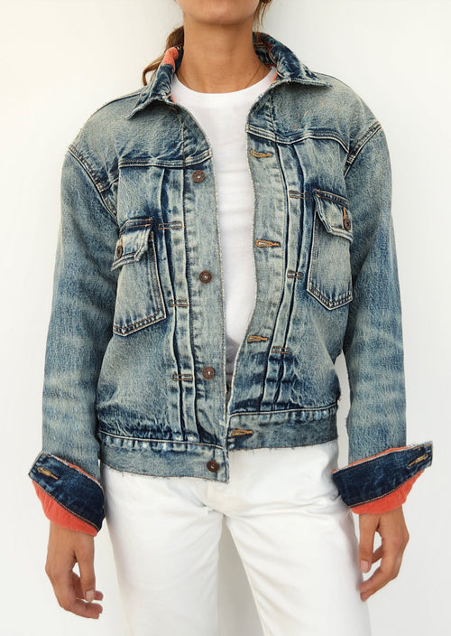 Boro Denim Beast of Burden Sakura Jacket. Elevate your jacket collection with Boro Denim's Sakura Jacket, a contemporary reimagining of the classic denim coat. This design boasts fabulous detailing, lined in a fun pop of color with a beautiful embellishment along the inside collar. Expertly tailored, this jacket was meant to be worn oversized.