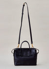 Cornelian Taurus Keyhole Mini in Black. 10" w x 7" h x 4"d Outer: 100% Cow Leather Linning: 100% Cotton Made in Japan Mini shoulder bag that can protect the contents with a flap cover. A bag with a flap cover design looks beautiful, but it takes time and effort to open the bag, which is inconvenient in terms of usability. In order to eliminate this inconvenience, a zipper is attached to the top of the bag to make opening and closing smoother and eliminate stress.