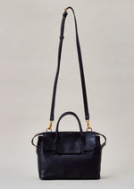 Cornelian Taurus Keyhole Mini in Black. 10" w x 7" h x 4"d Outer: 100% Cow Leather Linning: 100% Cotton Made in Japan Mini shoulder bag that can protect the contents with a flap cover. A bag with a flap cover design looks beautiful, but it takes time and effort to open the bag, which is inconvenient in terms of usability. In order to eliminate this inconvenience, a zipper is attached to the top of the bag to make opening and closing smoother and eliminate stress.
