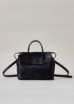 Cornelian Taurus Keyhole Mini in Black. 10" w x 7" h x 4"d Outer: 100% Cow Leather Linning: 100% Cotton Made in Japan Mini shoulder bag that can protect the contents with a flap cover. A bag with a flap cover design looks beautiful, but it takes time and effort to open the bag, which is inconvenient in terms of usability. In order to eliminate this inconvenience, a zipper is attached to the top of the bag to make opening and closing smoother and eliminate stress.