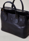 Cornelian Taurus Keyhole Mini in Black. 10" w x 7" h x 4"d Outer: 100% Cow Leather Linning: 100% Cotton Made in Japan Mini shoulder bag that can protect the contents with a flap cover. A bag with a flap cover design looks beautiful, but it takes time and effort to open the bag, which is inconvenient in terms of usability. In order to eliminate this inconvenience, a zipper is attached to the top of the bag to make opening and closing smoother and eliminate stress.