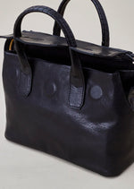 Cornelian Taurus Keyhole Mini in Black. 10" w x 7" h x 4"d Outer: 100% Cow Leather Linning: 100% Cotton Made in Japan Mini shoulder bag that can protect the contents with a flap cover. A bag with a flap cover design looks beautiful, but it takes time and effort to open the bag, which is inconvenient in terms of usability. In order to eliminate this inconvenience, a zipper is attached to the top of the bag to make opening and closing smoother and eliminate stress.