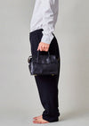 Cornelian Taurus Keyhole Mini in Black. 10" w x 7" h x 4"d Outer: 100% Cow Leather Linning: 100% Cotton Made in Japan Mini shoulder bag that can protect the contents with a flap cover. A bag with a flap cover design looks beautiful, but it takes time and effort to open the bag, which is inconvenient in terms of usability. In order to eliminate this inconvenience, a zipper is attached to the top of the bag to make opening and closing smoother and eliminate stress.