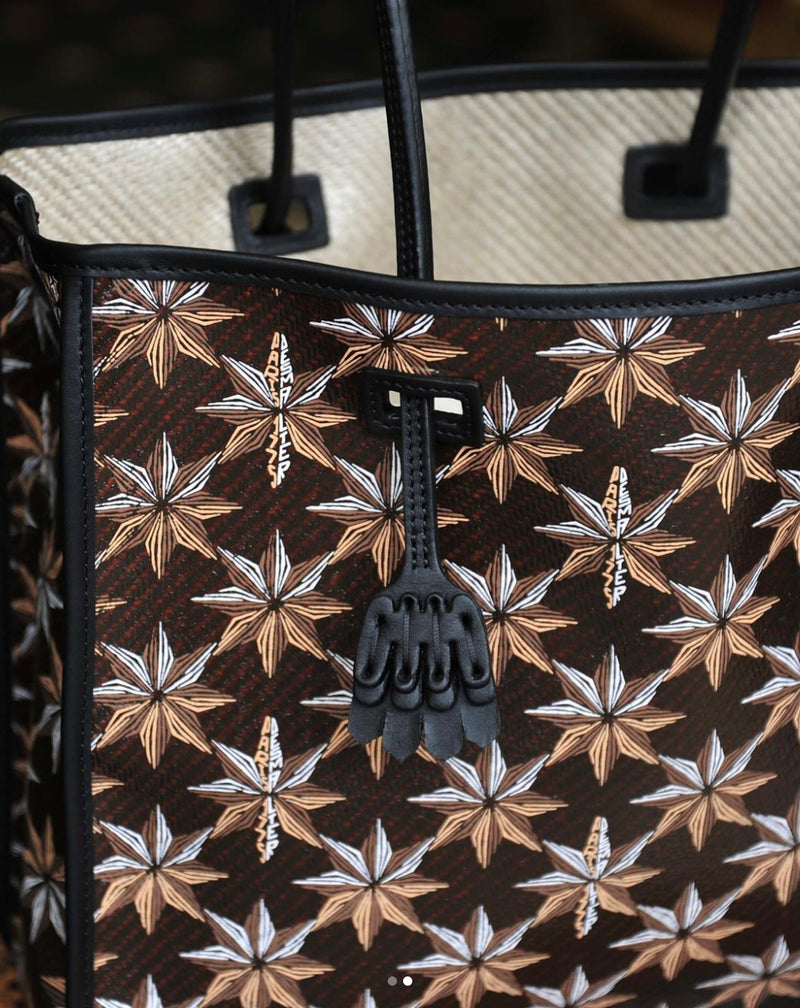 Desmalter Griffon Medium Tote Bag - Handpainted. The Lion’s Paw strap crosses from the traditional Desmalter armchairs which featured a winged lion and seven pointed star, all political and religious symbols, featured in their collection. This is sure to be your go to bag - their structured leather tote is lined in a pop of green.