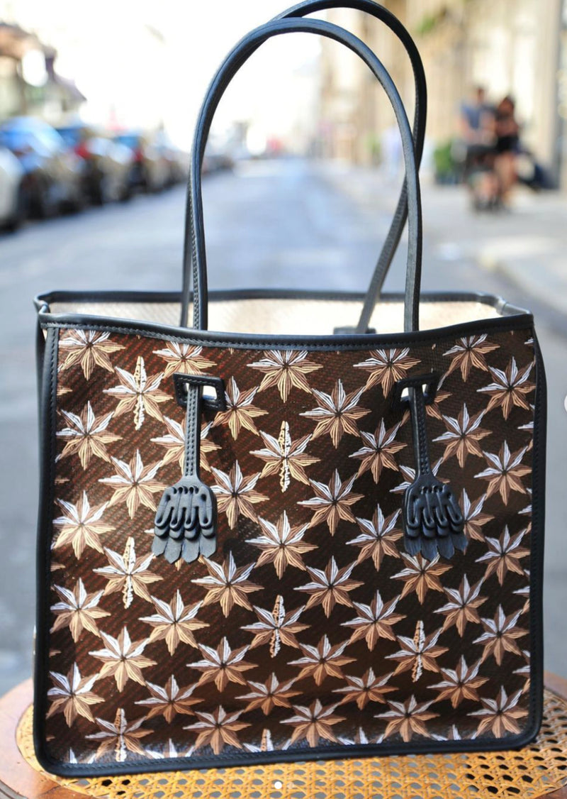 Desmalter Griffon Medium Tote Bag - Handpainted. The Lion’s Paw strap crosses from the traditional Desmalter armchairs which featured a winged lion and seven pointed star, all political and religious symbols, featured in their collection. This is sure to be your go to bag - their structured leather tote is lined in a pop of green.