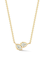 The Poppy Two-Stone Pendant is classic staple in any neck stack. An everyday essential, Poppy Two-Stone Pendant delicately hangs on the neck by an 18 inch adjustable ball chain. Handcrafted in 18-karat gold and featuring 0.40tcw of pear and marquise diamonds.   Handcrafted in 18-Karat Gold Yellow Gold Only Diamonds: 0.40tcw  Made in NYC. Jade Trau Poppy Two-Stone Pendant