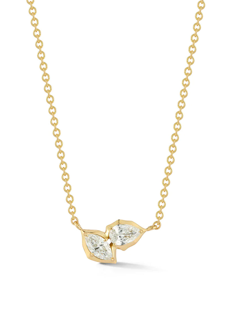 The Poppy Two-Stone Pendant is classic staple in any neck stack. An everyday essential, Poppy Two-Stone Pendant delicately hangs on the neck by an 18 inch adjustable ball chain. Handcrafted in 18-karat gold and featuring 0.40tcw of pear and marquise diamonds.   Handcrafted in 18-Karat Gold Yellow Gold Only Diamonds: 0.40tcw  Made in NYC. Jade Trau Poppy Two-Stone Pendant