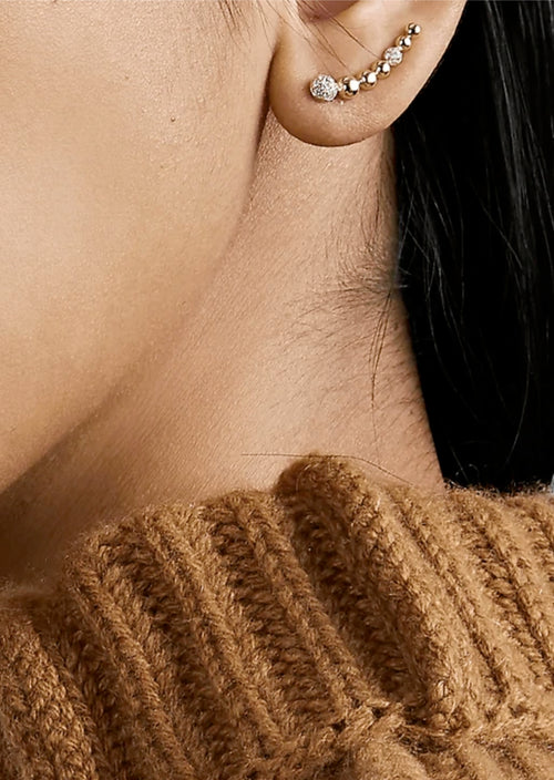 Sara Weinstock, crawler, crawler earrings, climber earring, single earring, gold earring, diamond earring. This ear crawler earring features 18k golden beads accented with two pave diamond clusters.