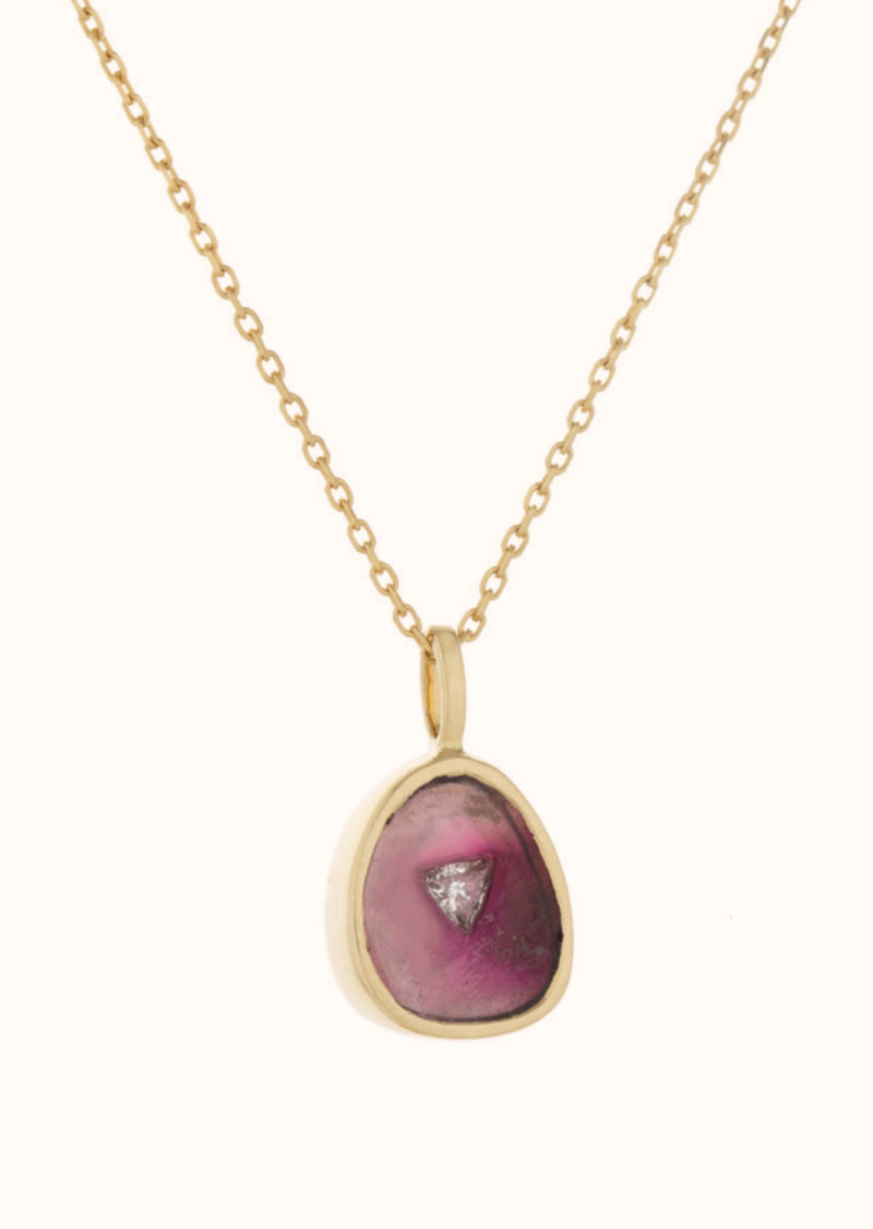 This stunning 14k yellow gold necklace features a gorgeous watermelon tourmaline and inlayed diamond. Each piece is unique - ranging in a gradient from vibrant pinks to warm greens.  Tourmaline, on of Celine's favorite stones, has many spiritual and healing powers as well as magnetic and protective properties. Blue tourmaline evokes tranquility and frees the mind to explore a higher level of consciousness. 