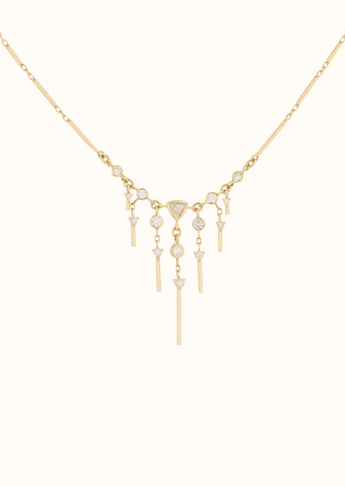 This stunning 14k yellow gold necklace features brilliant marquise diamonds - a gorgeous pendant full of glittering stones.Celine Daoust Dream Maker Triangle & Dangling Diamond Necklace