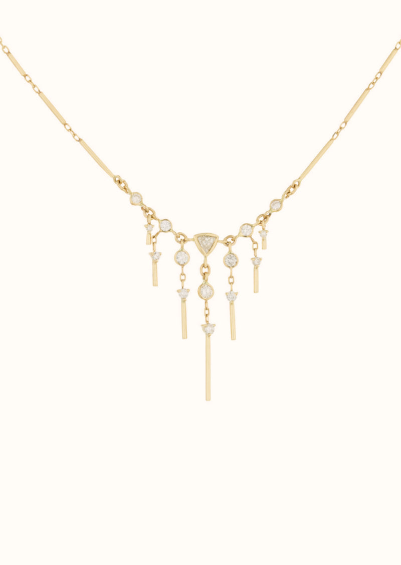 This stunning 14k yellow gold necklace features brilliant marquise diamonds - a gorgeous pendant full of glittering stones.Celine Daoust Dream Maker Triangle & Dangling Diamond Necklace